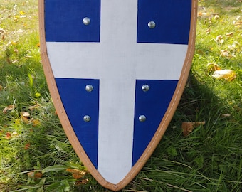 May include: A blue and white shield with a white cross in the center. The shield has a brown leather trim and metal rivets.