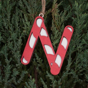May include: Red and white candy cane letter N Christmas ornament.