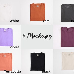 May include: Eight folded t-shirts in various colors, including white, yam, pepper, violet, berry, terracotta, black, and ivory. The text "8 Mockups" is written in cursive in the center of the image. The shirts are neatly arranged on a light background.