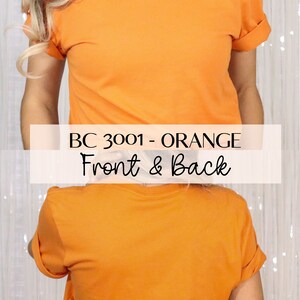 Pu&ograve; includere: Vista frontale e posteriore di una t-shirt arancione. La t-shirt &egrave; di stile basic con scollo rotondo e maniche corte. Il testo "BC 3001 - ORANGE" &egrave; stampato sulla parte anteriore della t-shirt.