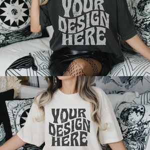 May include: Two women wearing oversized t-shirts with the text "YOUR DESIGN HERE" printed in a distressed, retro font. The shirts are in different colors, one is black and the other is white. Both women are wearing black skirts and fishnet stockings.