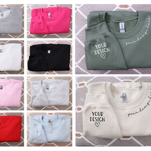 Peut inclure: Une collection de dix sweats à capuche de différentes couleurs, dont gris, rose, blanc, noir, bleu clair et rouge. Certains sweats à capuche ont le texte "your design" et un cœur imprimé dessus, tandis que d'autres ont le texte "your design here" imprimé dessus.