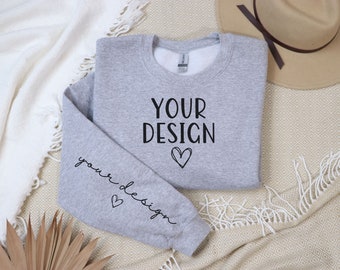 May include: Gray sweatshirt with the text "YOUR DESIGN" on the front and "your design" on the sleeve, both with a small heart graphic.