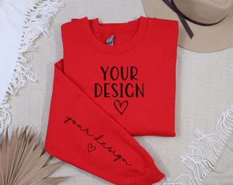 May include: Red sweatshirt with the text "YOUR DESIGN" and a heart on the front and the text "your design" and a heart on the sleeve.