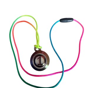May include: A circular pendant featuring the number 1 in the centre, suspended from a multicoloured cord that transitions from lime green to orange, pink, and blue. The pendant has a dark, metallic finish with a textured surface, and the cord includes a small black cylindrical clasp.
