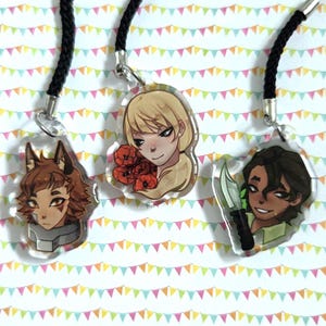 May include: Three clear acrylic pendant necklaces with black cords. Each pendant features a different anime-style character illustration. One has a wolf-like character, another a person with red flowers, and the last a person with a knife.