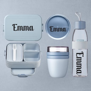 May include: A light blue lunch set comprising a rectangular lunchbox, a round container, a food jar, and a water bottle. Each item is personalised with the name "Emma" in a black, elegant font. The lunchbox includes a white fork.