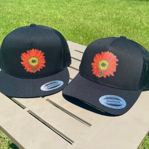 Steal Your Red Daisy trucker, flat bill, and flex fit style hats BMFS fan art