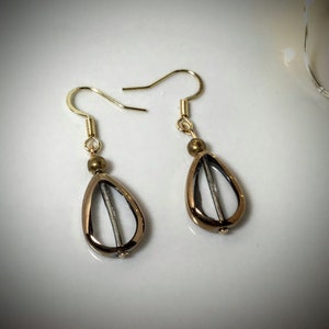 Tear Ducts and Rust Gold Tone 1.5 inch Dangling Earrings