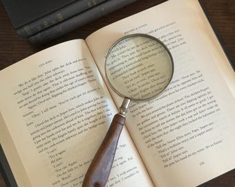 vintage magnifying glass with wooden handle