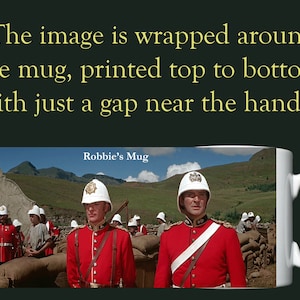 May include: A white ceramic mug with a full colour wrap-around image of a group of soldiers in red uniforms standing in a field. The text "Robbie's Mug" is printed on the mug.