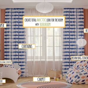 May include: A child's room decorated in an arctic theme with blue and white tie-dye curtains, a white bean bag chair with a geometric pattern, a white crib with a blue and white patterned pillow, a toy box, and a round rug with a pink and blue pattern. The text "CREATE TOTAL ARCTIC LOOK FOR THE ROOM WITH BUBUROOM" is displayed in the center of the image.