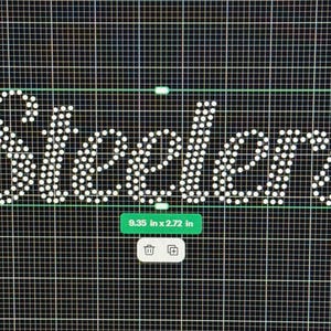 May include: The word "Steelers" is displayed in white dots on a black grid background. The text is outlined with a green rectangle. The dimensions are 9.35 inches by 2.72 inches.