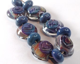 Encased multicolored lentil bead set (6 +7) with textured heart decoration - lampwork lentil beads - art beads for jewellery design