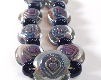Encased multicolored lentil bead set with textured heart decoration - lampwork lentil beads - art beads for jewellery design - Jolene Beads