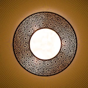 May include: A round, decorative ceiling light fixture with a black metal frame and intricate cut-out designs. The light fixture has a white, circular light source in the center.