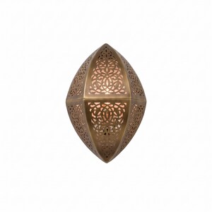 May include: A wall-mounted light fixture with a pointed, almond-shaped metal frame in a muted bronze finish. The surface features intricate, laser-cut filigree patterns that allow warm light to glow from within the hollow, geometric structure.