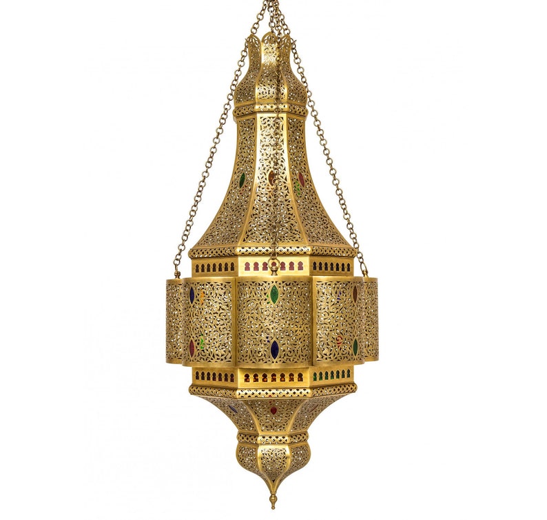 May include: A gold metal Moroccan pendant light with intricate cutouts and colorful glass accents.