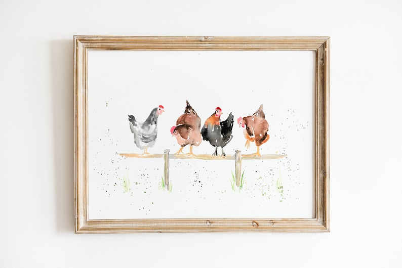 May include: Watercolor print of four chickens perched on a wooden fence. The chickens are in shades of gray, brown, and black with red combs. The artwork is framed in a light brown wooden frame.