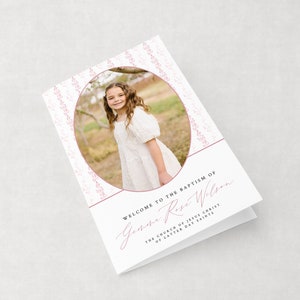 May include: A folded baptism invitation with a photo of a young girl in a white dress. The invitation has a pink floral design and the text "WELCOME TO THE BAPTISM OF Gemma Rose Wilson" and "THE CHURCH OF JESUS CHRIST OF LATTER DAY SAINTS."