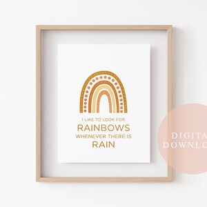 May include: A framed art print featuring a stylized rainbow in shades of brown and gold. The print includes the text "I like to look for rainbows whenever there is rain." The words "Digital Download" are also visible.