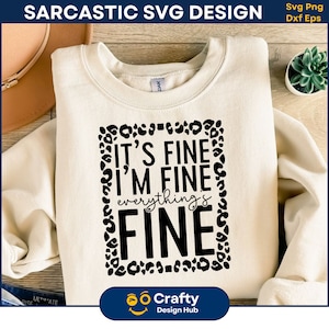 May include: A white sweatshirt with a black graphic that says "It's fine, I'm fine, everything's fine" in a leopard print frame.