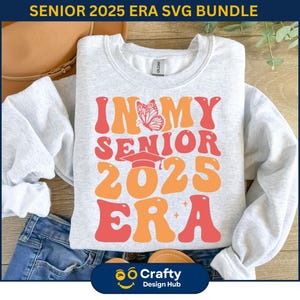 May include: A grey sweatshirt with the text "In My Senior 2025 Era" in a retro font with a butterfly and graduation cap graphic.