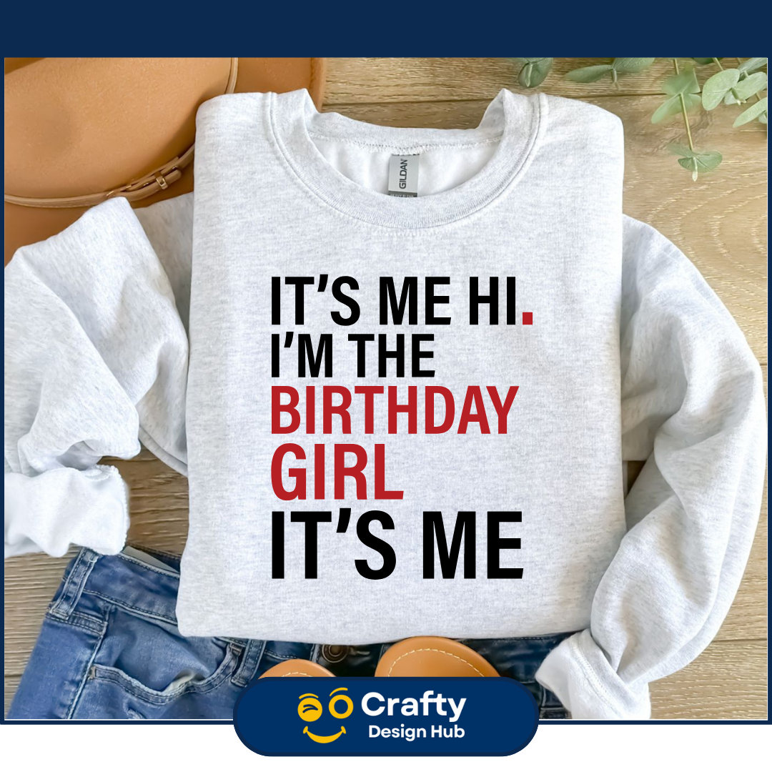 May include: Gray sweatshirt with the text "It's me hi. I'm the birthday girl. It's me" in black and red lettering.