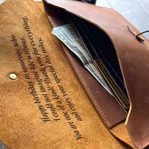 May include: A brown leather wallet with a personalized inscription that reads "Happy birthday to someone who I could not imagine life without. You are one of a kind! Thank you for everything, and enjoy your special day today."