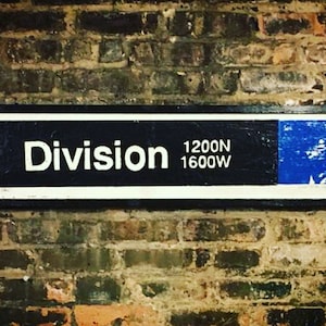 May include: A black and white sign with the word "Division" and the address "1200N 1600W" in white text. The sign has a blue square in the upper right corner.
