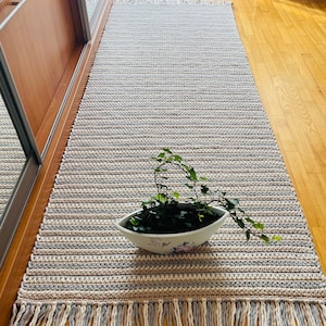 Crocheted long country style rug from cotton ropes