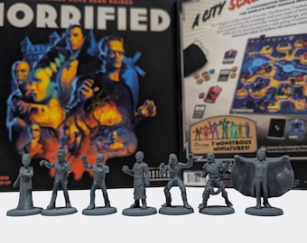 May include: A board game titled "Horrified" with a colorful illustration of classic movie monsters. Seven gray monster miniatures are in front of the game box. The game box features the text "Horrified" and "A City of Scares".