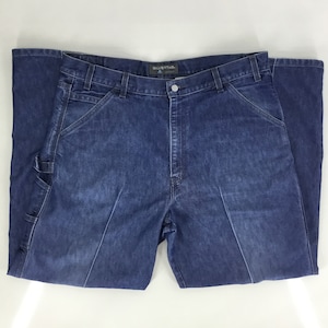 May include: A pair of blue denim carpenter jeans with the brand name "Silverstar" on the back waistband.