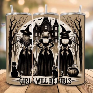 May include: Three witches in black dresses and pointed hats stand in front of a spooky house with a full moon in the background. The text "Girls Will Be Girls" is printed below the witches.