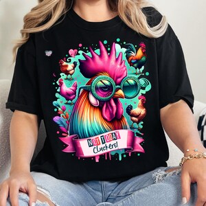 May include: Black t-shirt with a colorful rooster wearing sunglasses and a banner that says "Not Today Cluckers!"