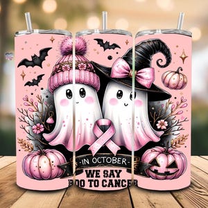 May include: Pink Halloween-themed tumbler featuring two cartoon ghosts, one in a pink hat and the other in a witch hat. The design includes bats, pumpkins, and a pink ribbon, with the text "In October We Say Boo To Cancer."