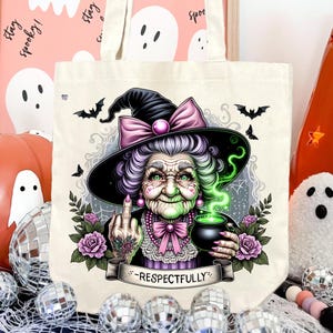 May include: Off-white tote bag featuring a detailed illustration of a witch with a black hat, purple hair, and a green face. The witch is holding a cauldron and giving the middle finger. The text "-Respectfully-" is on a banner.
