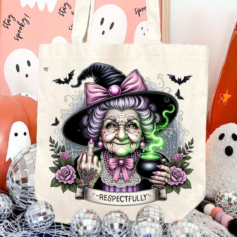 May include: Off-white tote bag featuring a detailed illustration of a witch with a black hat, purple hair, and a green face. The witch is holding a cauldron and giving the middle finger. The text "-Respectfully-" is on a banner.