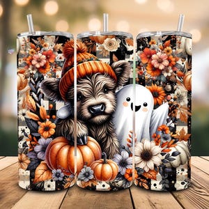 May include: Three stainless steel tumblers with a seasonal design. Each tumbler features a cartoon Highland cow in an orange hat, a friendly ghost, pumpkins, and floral accents. The background has a black and white checkered pattern.