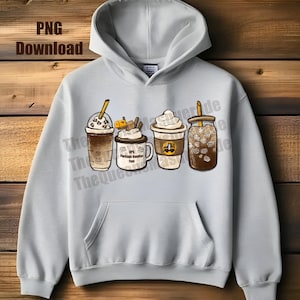 May include: Light gray hoodie featuring four illustrated coffee drinks: a frappe, a mug with whipped cream and chocolate, a coffee cup, and an iced coffee. The hoodie has a front pocket and a hood. The text "PNG Download" is in the top left corner.