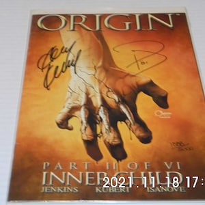 May include: A comic book cover featuring a close-up of a hand with claws, with the title "ORIGIN" and the text "PART II OF VI INNER CHILD" at the bottom. The cover is signed by three different people.