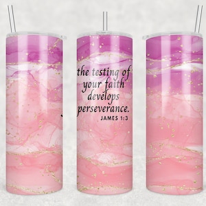 May include: A stainless steel tumbler with a lid and straw. The tumbler features a pink and purple watercolor design with gold flecks and the text "the testing of your faith develops perseverance. James 1:3."