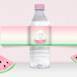 May include: A clear plastic water bottle with a pink cap and a decorative label. The label features a watermelon design and the text "ONE melba". Two watermelon slices are on the sides.