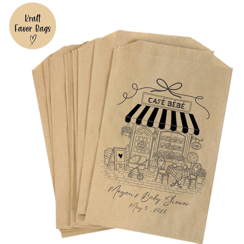 May include: Kraft favor bags in a stack, made of brown paper. Each bag features a black and white illustration of a cafe with the text "CAF&Eacute; B&Eacute;B&Eacute;". The bags are personalized with the text "Megan's Baby Shower May 9, 2026".