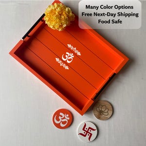 May include: Orange wooden serving tray with black handles and white Om symbol. Includes matching coasters with various designs. A yellow flower and text that says "Many Color Options Food Safe" are also visible.