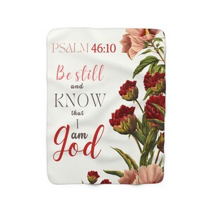 Puede incluir: Un fondo blanco con un diseño floral con flores rojas y rosas. El texto "PSALM 46:10" está en la parte superior de la imagen. El texto "Be still and KNOW that I am God" está en una fuente decorativa.