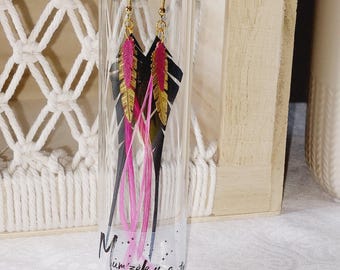 Inner tube feather earrings with gold and fuchsia feather prints and feather.
