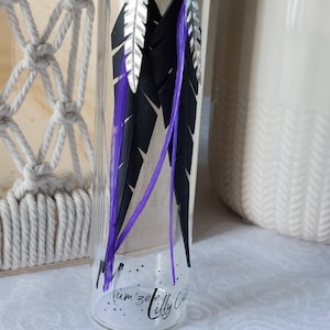Inner tube feather earrings with silver and purple feather prints with real feather