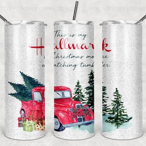 May include: A white tumbler with a glitter finish features a red truck carrying a Christmas tree and presents. The text "This is my Hallmark Christmas movie watching tumbler" is printed on the tumbler.