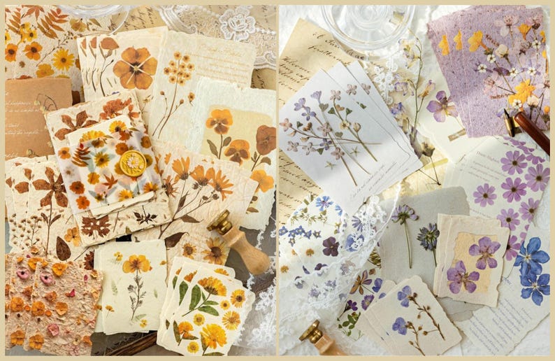 May include: A collection of handmade paper and cards featuring pressed flowers in shades of yellow, orange, and purple. The paper has a rustic, vintage aesthetic, with some pieces bearing floral designs and handwritten text.